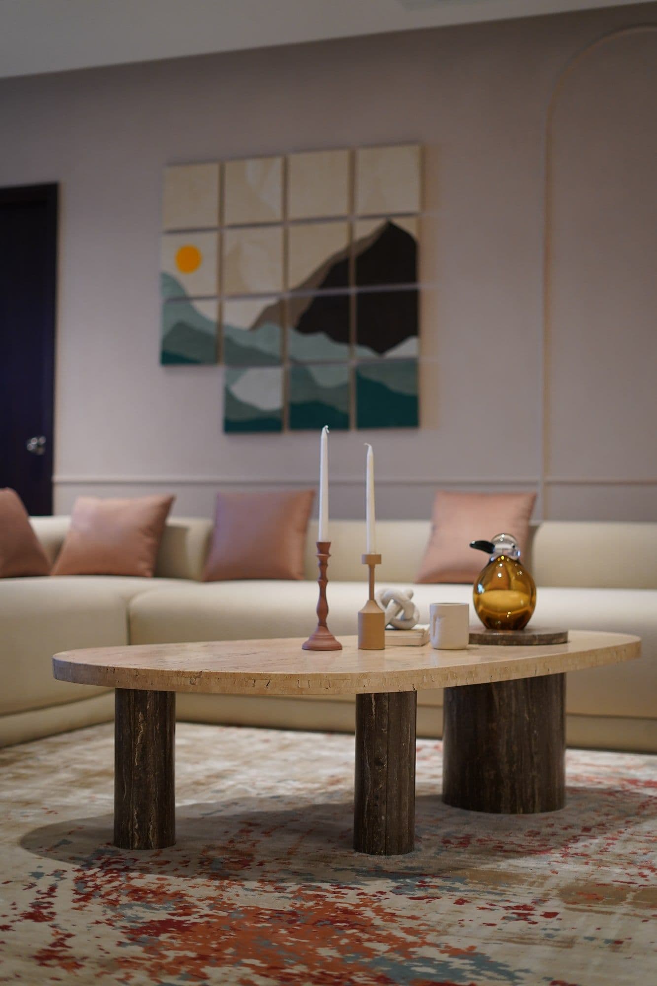 Bespoke OSIMIRI living room with a sofa styled around custom stone coffee tables
